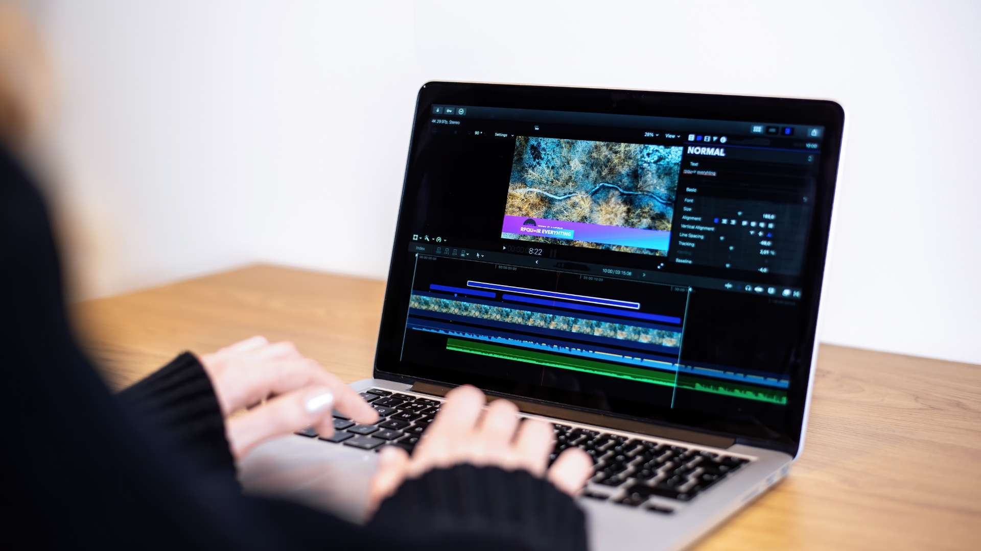 A person doing graphics editing on Macbook block 9 vancouver